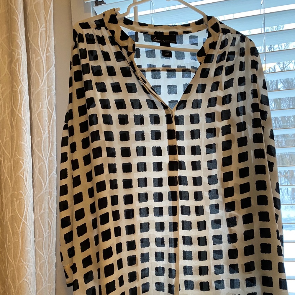 White blouse with black squares
